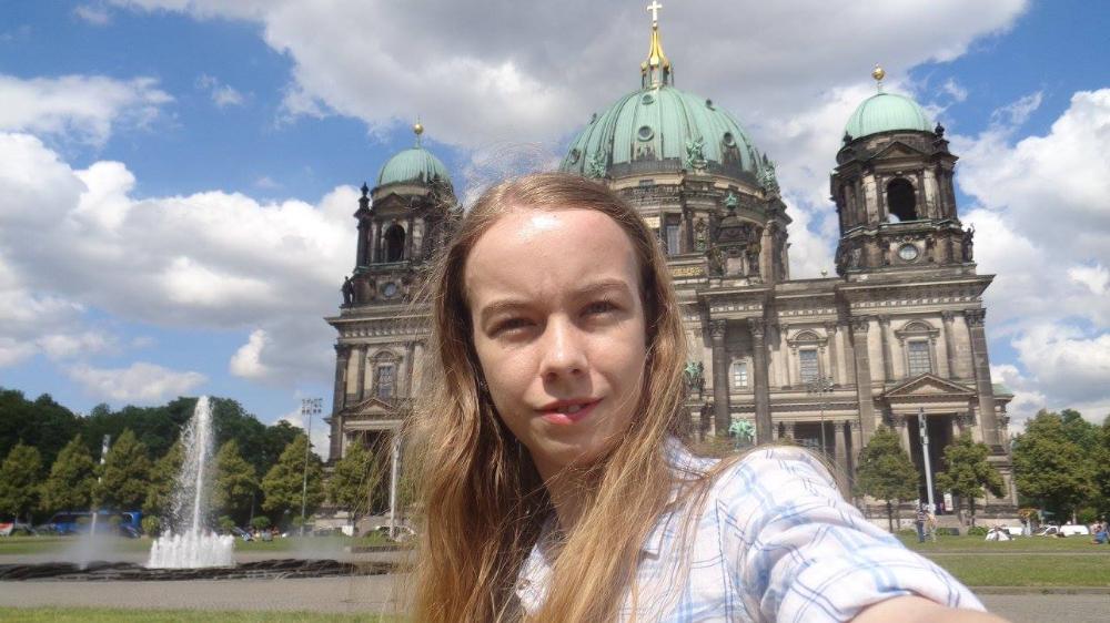 girl in front of historic buil