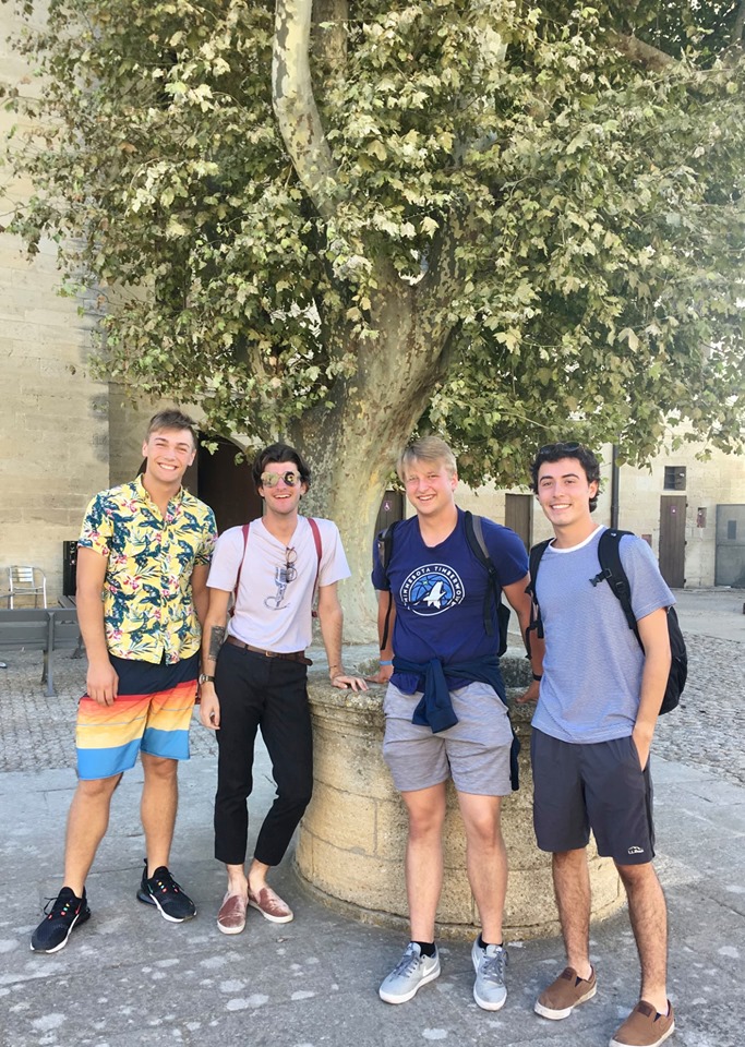 Four students under a tree